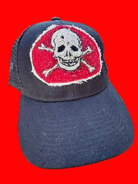 black cap with skull patch
